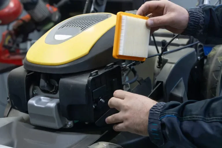 How do you change a lawn mower air filter?