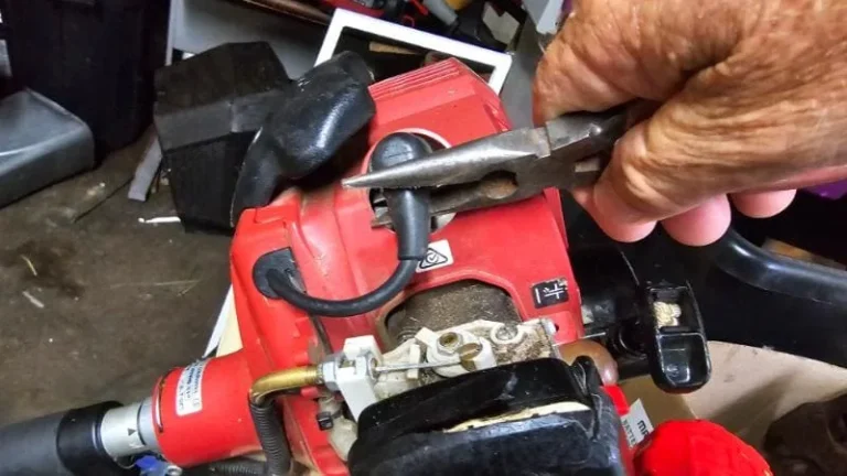 How do you replace a lawn mower spark plug?
