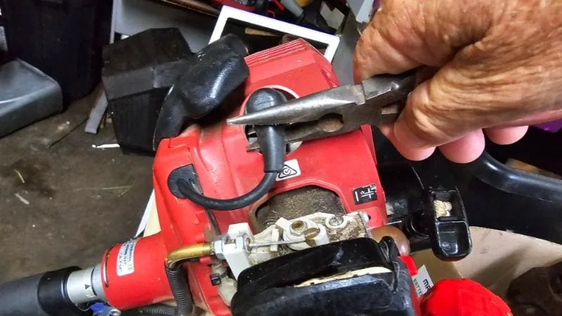 How do you replace a lawn mower spark plug?