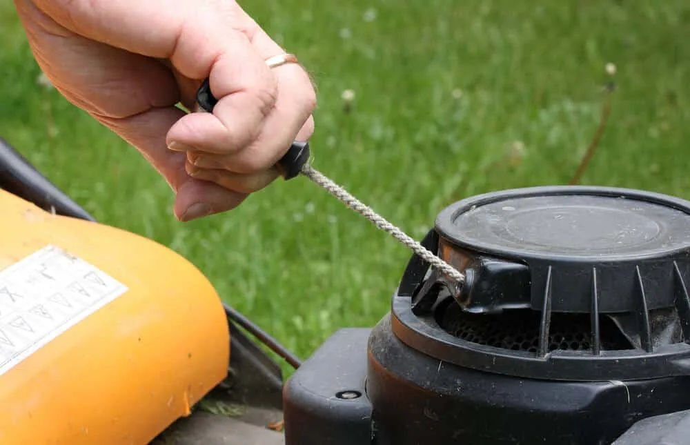 How do you start a lawn mower?
