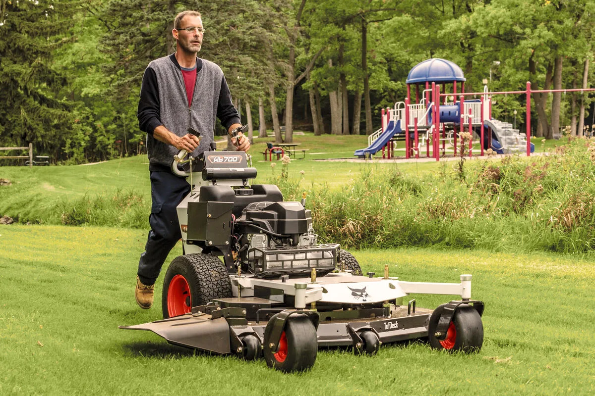 Self-propelled walk-behind vs riding mower for uneven ground